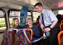 photo of bus conducter and students
